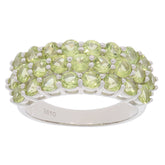 Elegant sterling silver ring adorned with multiple round green gemstones in a stunning design.